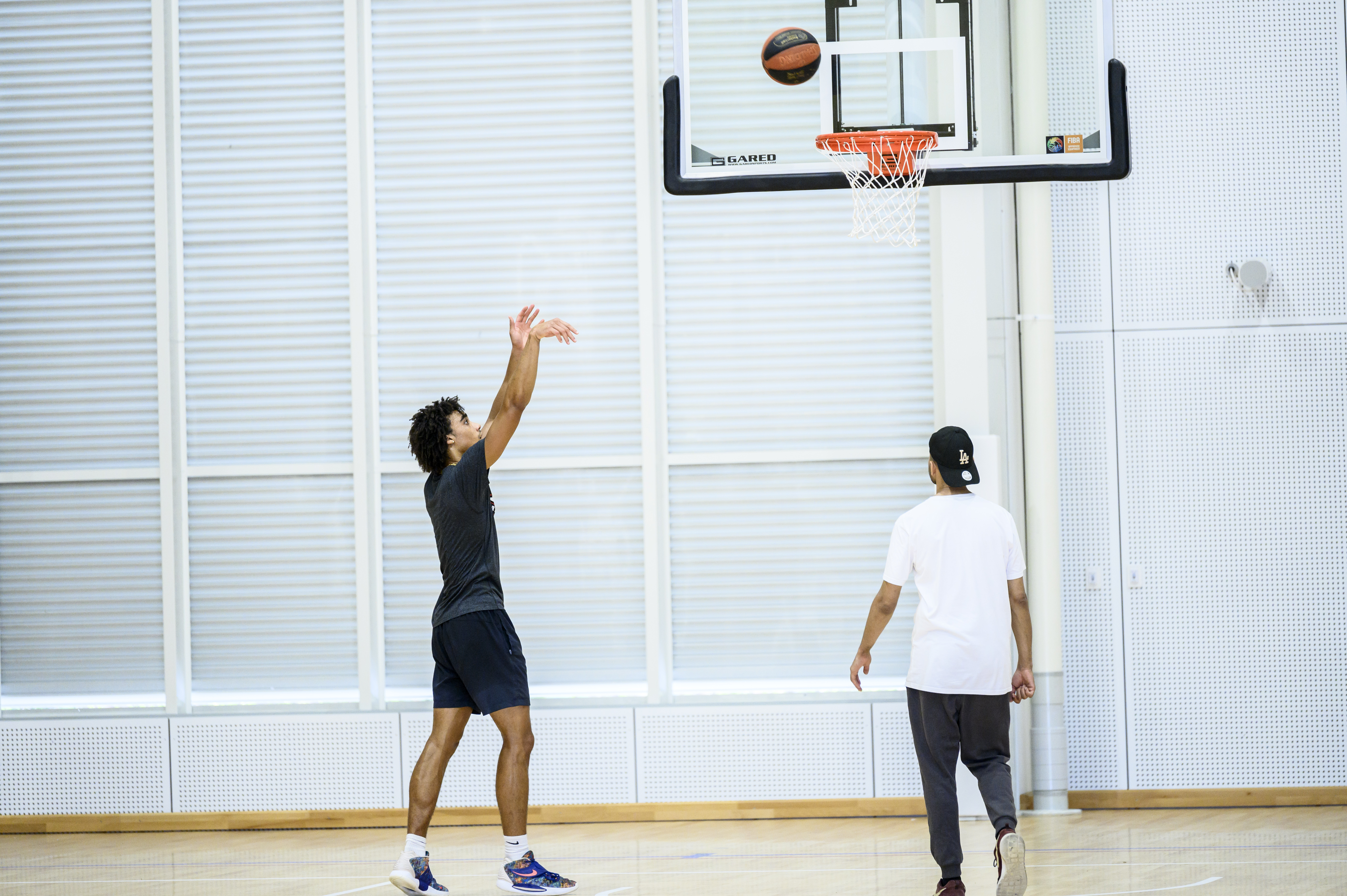 two men playing basketball