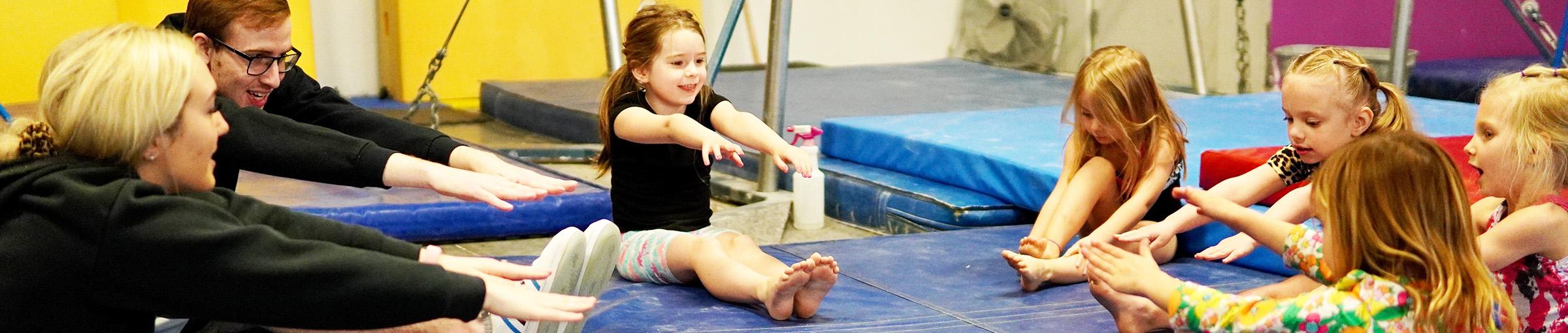 Children and teachers stretching