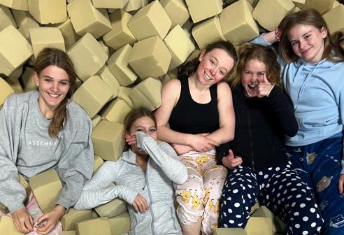 gymnasts in foam pit